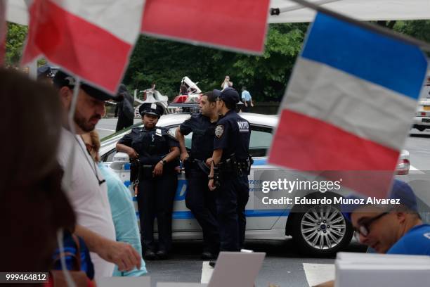 Officers stand guard as fans arrive to watch the World Cup final soccer match between France and Croatia on July 15, 2018 in New York City. France is...