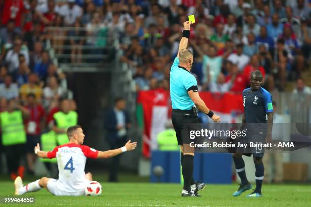 Referee Nestor Pitana shows Ngolo Kante of France a yellow card during the 2018 FIFA World Cup Russia Final between France and Croatia at Luzhniki...