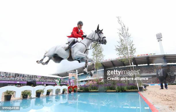 Austria's show jumper Max Kuehner on horse Chardonnay in action during the single show jumping competition of the FEI European Championships 2017 in...