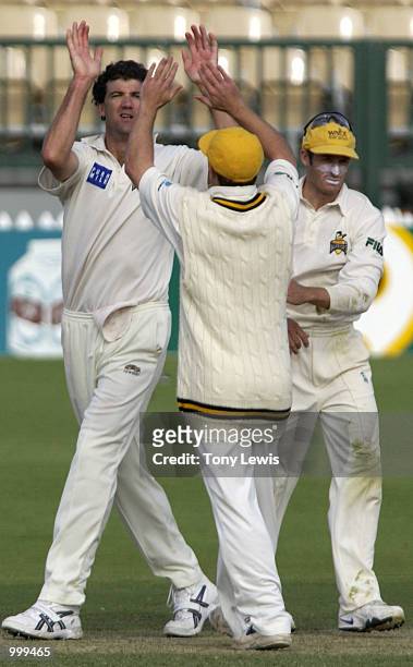West Australian bowler Jo Angel celebrates ending the South Australian innings by taking the wicket of Mark Harrity, lb for 0, in the Pura Cup match...