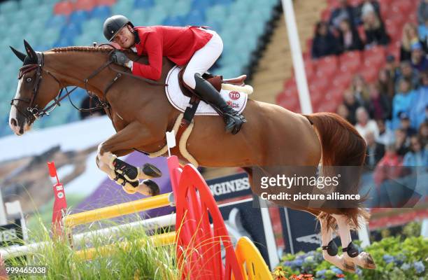 Belgium's show jumper Jérome Guery on horse Grand Cru van de Rozenberg in action during the single show jumping competition of the FEI European...