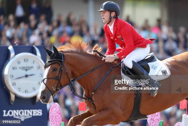 Germany's show jumper Marcus Ehning on horse Pret A Tout in action during the single show jumping competition of the FEI European Championships 2017...
