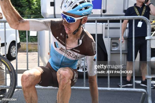 France's Romain Bardet gets up after catching his breath following the ninth stage of the 105th edition of the Tour de France cycling race between...
