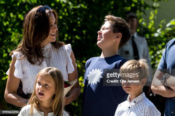 Crown Princess Mary Princess tease Prince Christian with a flower bouquet during he Tilting-At-The-Ring Riders Event at Graasten Castle at Graasten...