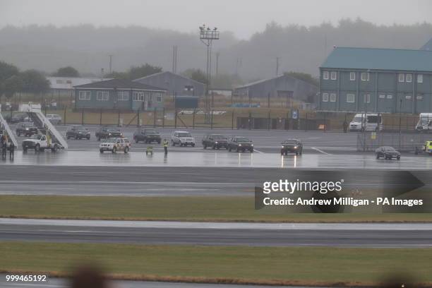 The US presidential convoy arrives at Air Force One at Prestwick airport in Ayrshire, as US President Donald Trump and his wife Melania prepare to...