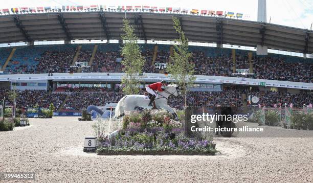 The Belgian show jumper Gregory Wathelet on horse Coree in action during the single show jumping competition of the FEI European Championships 2017...