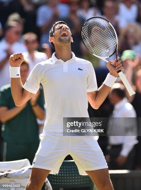 Serbia's Novak Djokovic celebrates after beating South Africa's Kevin Anderson 6-2, 6-2, 7-6 in their men's singles final match on the thirteenth day...