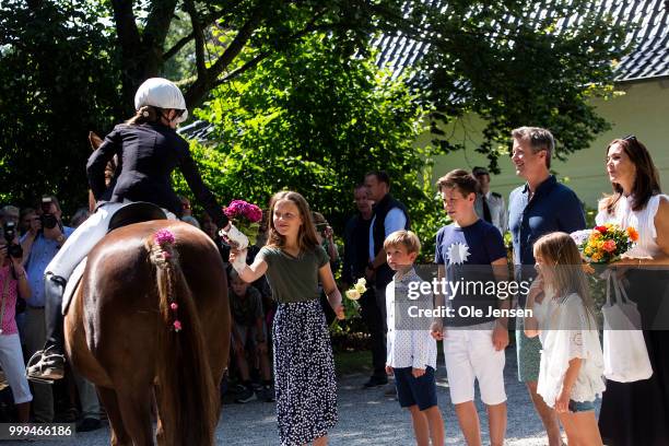 Princess Isabella receives a flower bouquet during the Tilting-At-The-Ring Riders Event at Graasten Castle at Graasten on July 15, 2018 in Graasten,...