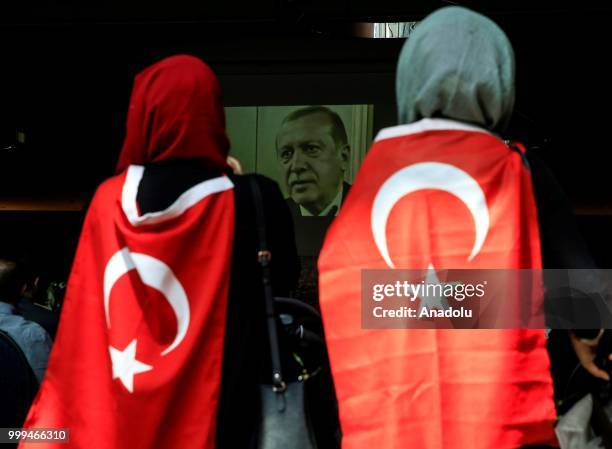 People attend a ceremony during the July 15 Democracy and National Unity Day to mark July 15 defeated coup's 2nd anniversary at Turkish Embassy in...