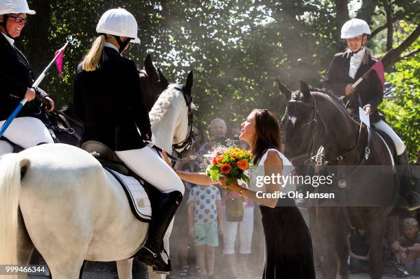 Crown Princess Mary of Denmark receives a flower bouquet during the Tilting-At-The-Ring Riders Event at Graasten Castle at Graasten on July 15, 2018...