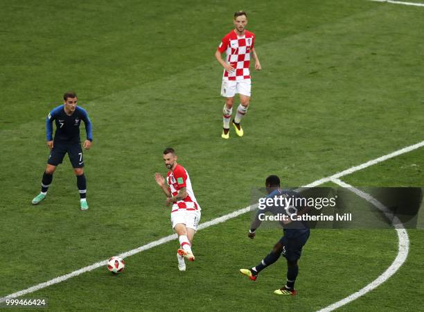 Paul Pogba of France has a shot blocked, before scoring the rebound, his teams third goal during the 2018 FIFA World Cup Final between France and...