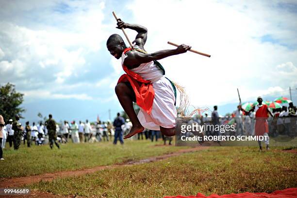 Burundi's Nkurunziza on God and grassroots development** A traditional Burundian drummer leaps in the air during a presentation at a political rally...