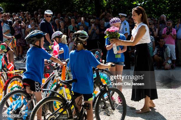 Crown Princess Mary of Denmark receives a flower bouquet during the Tilting-At-The-Ring Riders Event at Graasten Castle at Graasten on July 15, 2018...