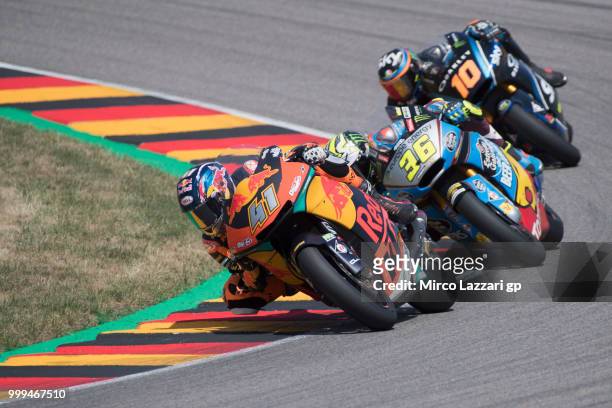Brad Binder of South Africa and Red Bull KTM Ajo leads the field during the Moto2 race during the MotoGp of Germany - Race at Sachsenring Circuit on...