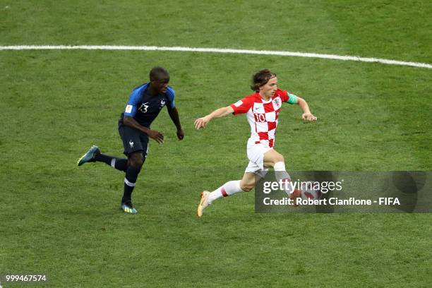 Luka Modric of Croatia is challenged by Ngolo Kante of France during the 2018 FIFA World Cup Final between France and Croatia at Luzhniki Stadium on...