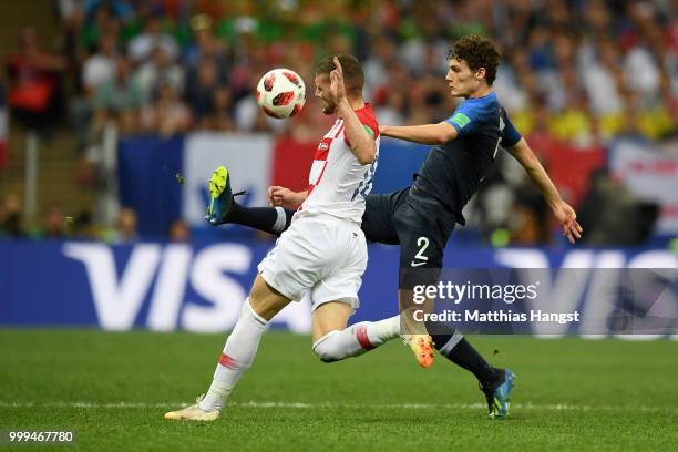 Benjamin Pavard of France and Ante Rebic of Croatia compete for the ball during the 2018 FIFA World Cup Final between France and Croatia at Luzhniki...