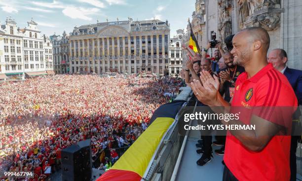 Belgium's Vincent Kompany celebrates at the Grand Place/Grote Markt in Brussels city center, as Belgian national soccer team Red Devils arrive to...