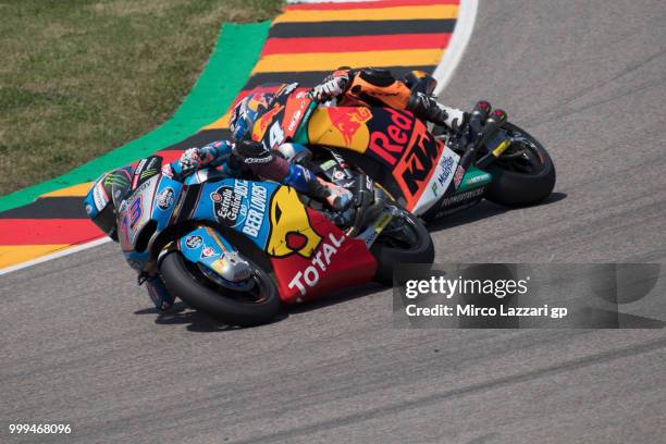 Alex Marquez of Spain and EG 0,0 Marc VDS leads Miguel Oliveira of Portugal and Red Bull KTM Ajo during the Moto2 race during the MotoGp of Germany -...
