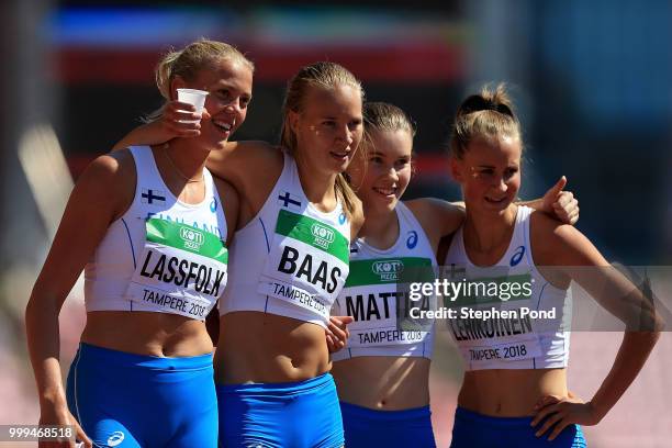 Nea Mattila, Mette Baas, Wilma Lassfolk and Vivi Lehikoinen of Finald pose for a picture ahead of heat 3 of the women's 4x400m relay heats on day...