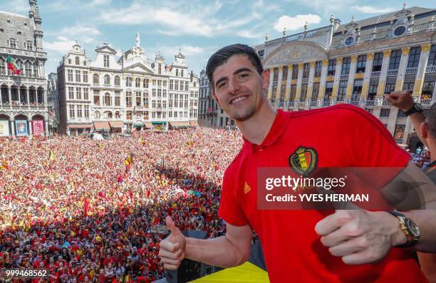 Belgium's goalkeeper Thibaut Courtois celebrates at the Grand Place/Grote Markt in Brussels city center, as Belgian national football team Red Devils...