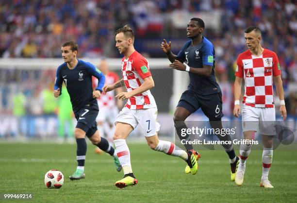 Paul Pogba of France chases down Ivan Rakitic of Croatia during the 2018 FIFA World Cup Final between France and Croatia at Luzhniki Stadium on July...