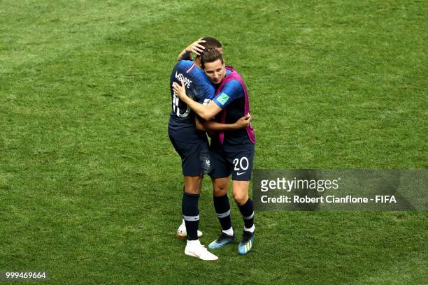 Kylian Mbappe of France celebrates with teammate Florian Thauvin after scoring his team's fourth goal during the 2018 FIFA World Cup Final between...