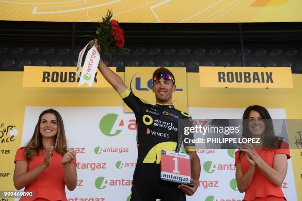 France's Damien Gaudin celebrates on the podium after being named the stage's most aggressive rider after the ninth stage of the 105th edition of the...