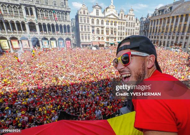 Belgium's captain Eden Hazard celebrates at the Grand Place/Grote Markt in Brussels city center, as Belgian national football team Red Devils arrive...