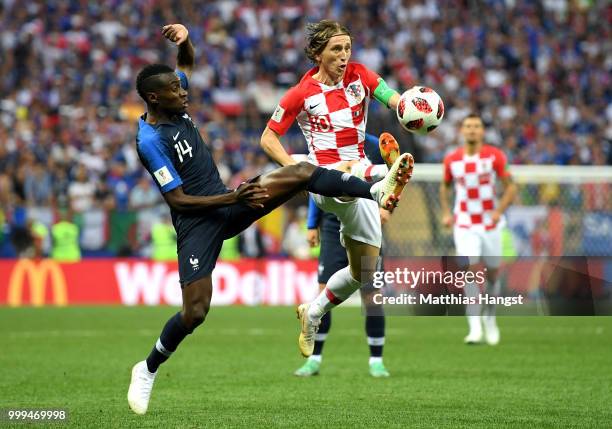 Blaise Matuidi of France tackles Luka Modric of Croatia during the 2018 FIFA World Cup Final between France and Croatia at Luzhniki Stadium on July...