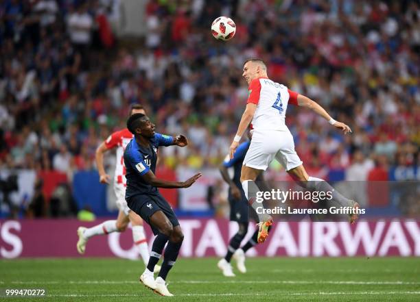 Blaise Matuidi of France and Ivan Perisic of Croatia battle for the header during the 2018 FIFA World Cup Final between France and Croatia at...