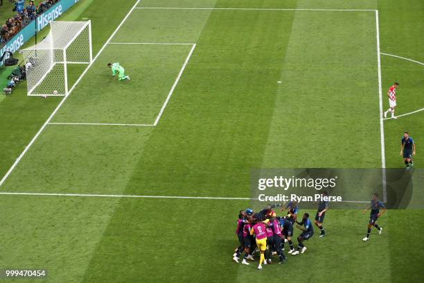 Kylian Mbappe of France celebrates with team mates after scoring his team's fourth goal during the 2018 FIFA World Cup Final between France and...