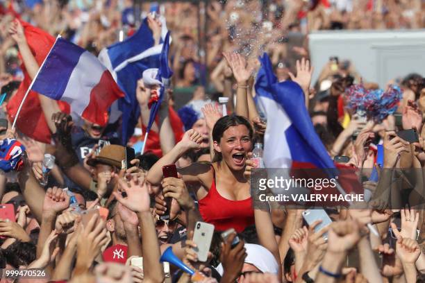 People gather on July 15, 2018 to watch the Russia 2018 World Cup final football match between France and Croatia, in the southern French city of...