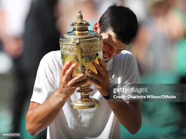 Mens Singles Final - Novak Djokovic v Kevin Anderson - Novak Djokovic poses with the winners trophy at All England Lawn Tennis and Croquet Club on...