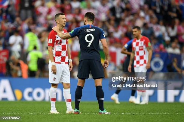 Olivier Giroud of France speaks with Ivan Perisic of Croatia during the 2018 FIFA World Cup Final between France and Croatia at Luzhniki Stadium on...