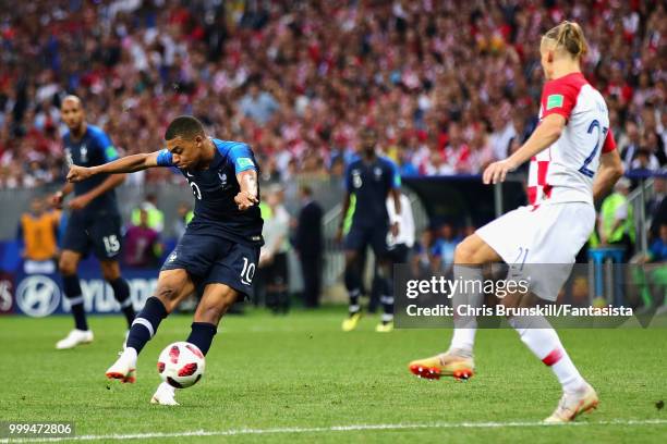 Kylian Mbappe of France scores his sides fourth goal during the 2018 FIFA World Cup Russia Final between France and Croatia at Luzhniki Stadium on...