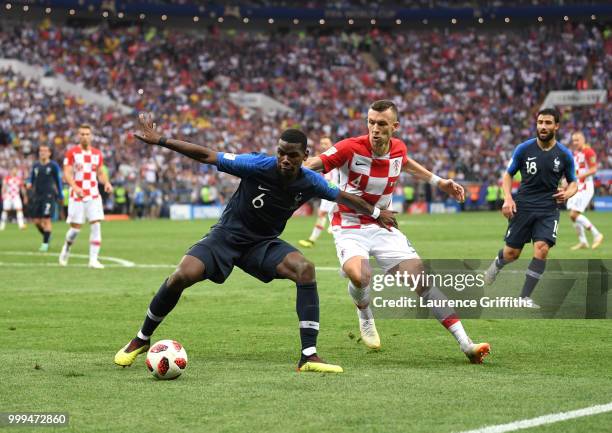 Paul Pogba of France is challened by Ivan Perisic of Croatia during the 2018 FIFA World Cup Final between France and Croatia at Luzhniki Stadium on...