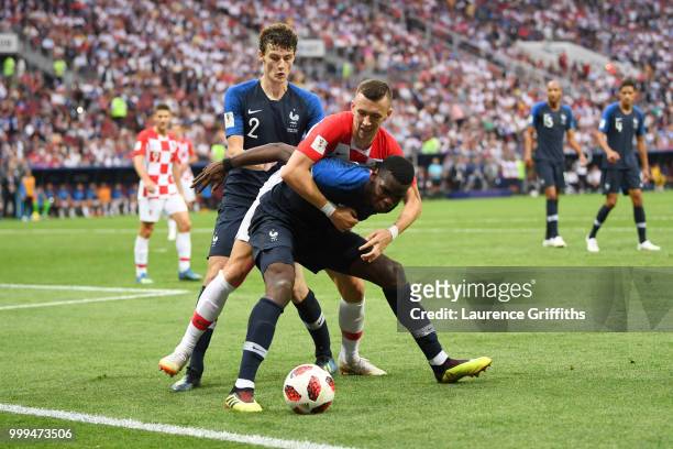Paul Pogba of France is challened by Ivan Perisic of Croatia during the 2018 FIFA World Cup Final between France and Croatia at Luzhniki Stadium on...