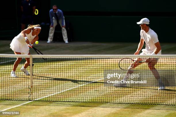 Jamie Murray of Great Britain and Victoria Azarenka of Belarus return against Alexander Peya of Austria and Nicole Melichar of The United States...