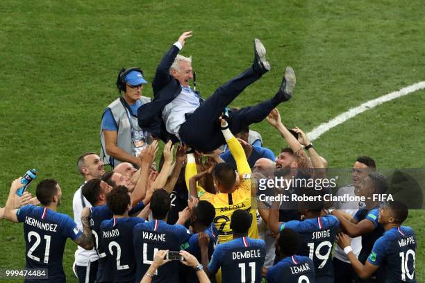 France players celebrate with Didier Deschamps, Manager of France following their sides victory in the 2018 FIFA World Cup Final between France and...
