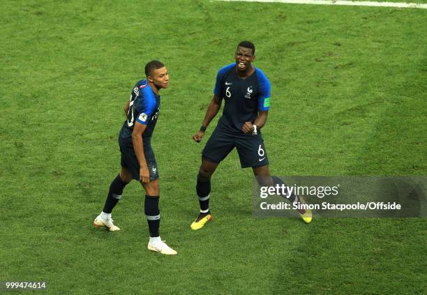 Kylian Mbappe of France and Paul Pogba of France celebrate the fourth goal during the 2018 FIFA World Cup Russia Final between France and Croatia at...