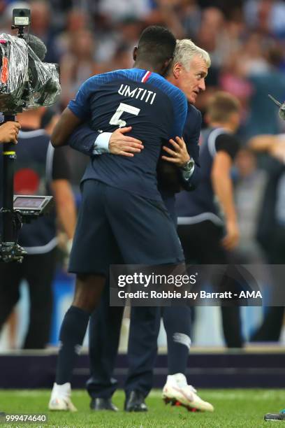 Samuel Umtiti of France celebrates with Didier Deschamps head coach / manager of France at the end of the 2018 FIFA World Cup Russia Final between...