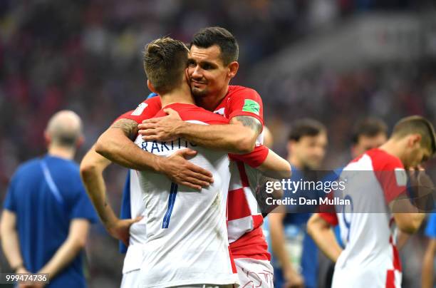 Dejan Lovren and Ivan Rakitic of Croatia look dejected following the 2018 FIFA World Cup Final between France and Croatia at Luzhniki Stadium on July...