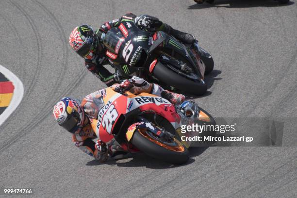 Dani Pedrosa of Spain and Repsol Honda Team leads Johann Zarco of France and Monster Yamaha Tech 3 during the MotoGP race during the MotoGp of...