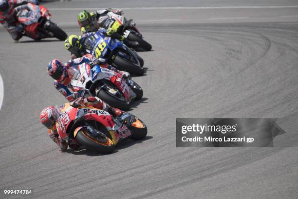 Marc Marquez of Spain and Repsol Honda Team leads the field during the MotoGP race during the MotoGp of Germany - Race at Sachsenring Circuit on July...