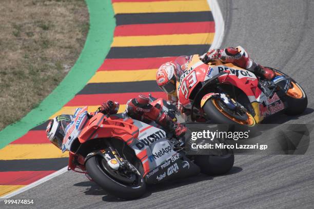 Jorge Lorenzo of Spain and Ducati Team leads Marc Marquez of Spain and Repsol Honda Team during the MotoGP race during the MotoGp of Germany - Race...