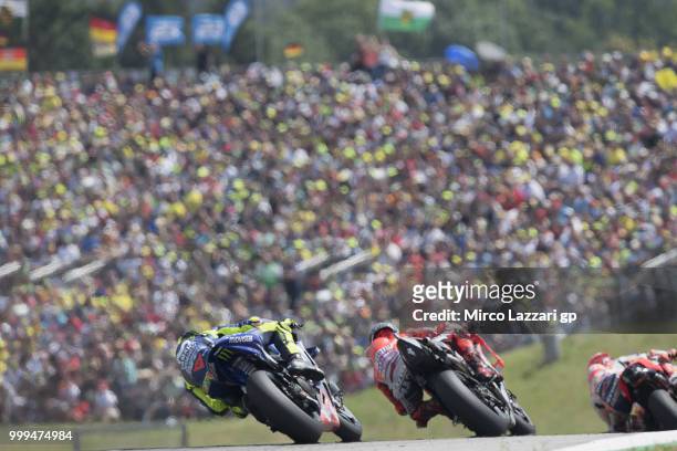 Marc Marquez of Spain and Repsol Honda Team leads the field during the MotoGP race during the MotoGp of Germany - Race at Sachsenring Circuit on July...