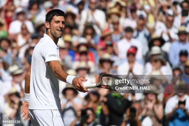 Serbia's Novak Djokovic celebrates after beating South Africa's Kevin Anderson 6-2, 6-2, 7-6 in their men's singles final match on the thirteenth day...