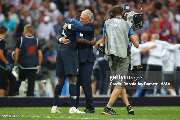 Samuel Umtiti of France celebrates with Didier Deschamps head coach / manager of France at the end of the 2018 FIFA World Cup Russia Final between...