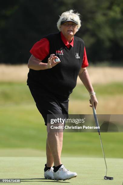 Laura Davies of England reacts to birdie putt on the second green during the final round of the U.S. Senior Women's Open at Chicago Golf Club on July...