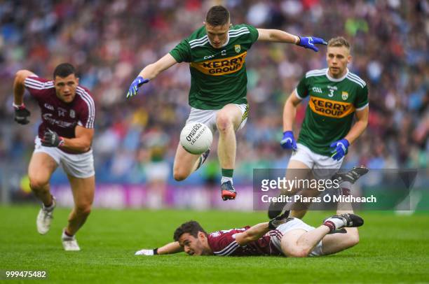 Dublin , Ireland - 15 July 2018; Jason Foley of Kerry jumps over Ian Burke of Galway as Damien Comer of Galway and Peter Crowley of Kerry look on...